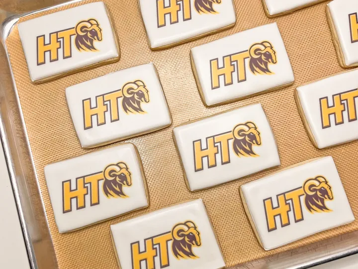 A dozen printed custom cookies